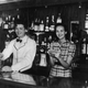 Jessica Mitford in 1940 with husband Esmond Romilly in the bar of the Roma Restaurant in Biscayne Bay, Miami, which they opened after eloping. Photo via Getty Images.